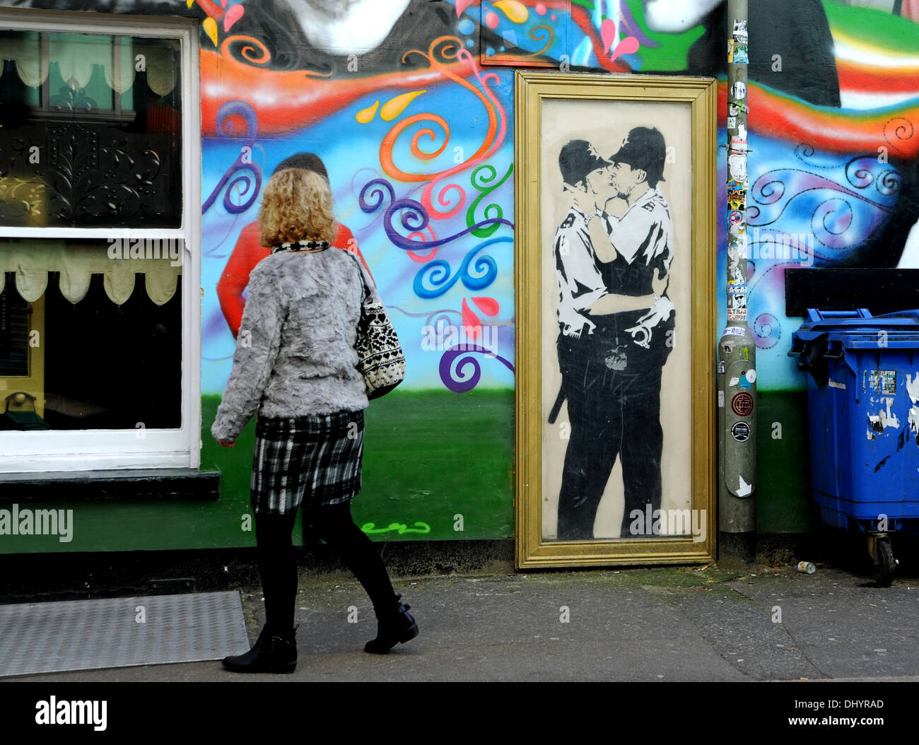 A canvas copy of Banksy graffiti art of the two Kissing Policemen (Kissing Coppers) on wall at Prince Albert Pub in Brighton UK  plus George Best - Stock Photo