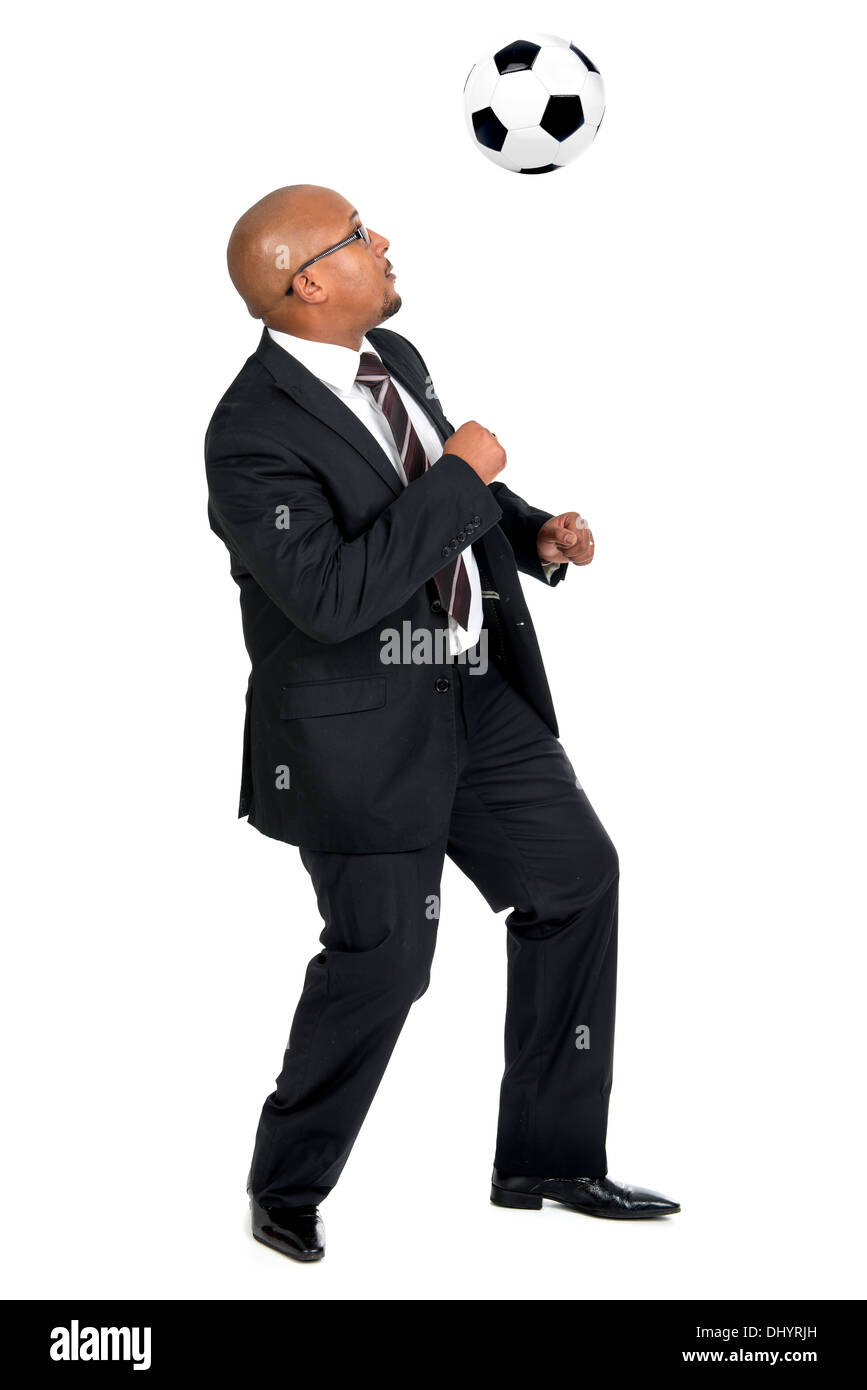 Businessman playing soccer ball isolated in white Stock Photo - Alamy
