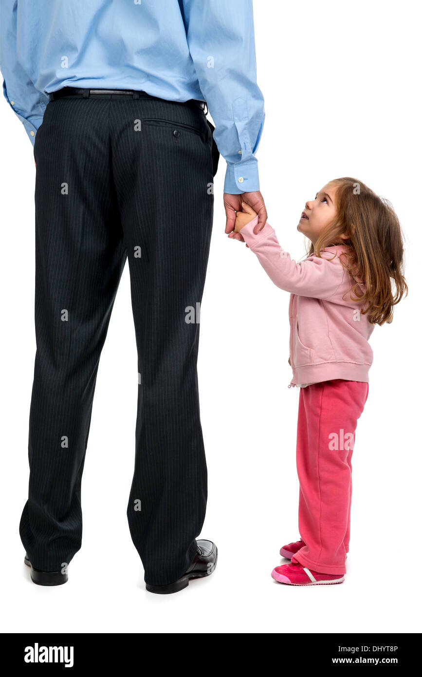 Young girl holding her father's hand Stock Photo
