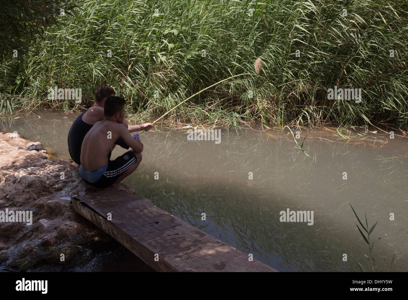 Two boys fishing in river hi-res stock photography and images - Alamy