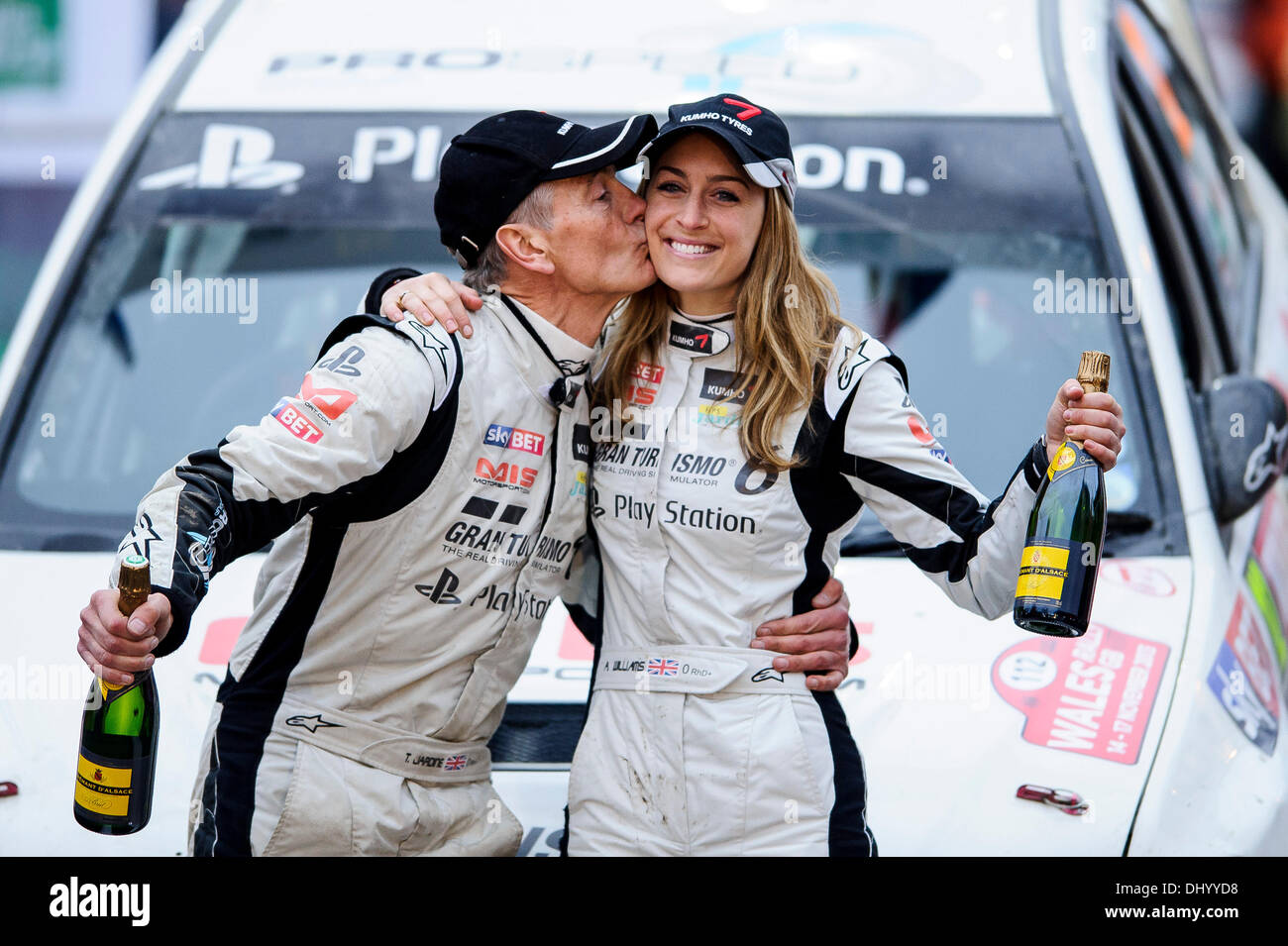 Llandudno, Wales. 17th Nov, 2013. Class 3 winners Tony Jardine kisses ex Team GB Olympic Skeleton Champion Amy Williams MBE of Great Britain (GBR) as they celebrate by their Mitsubishi Lancer Evolution IX on the finish ramp after the Great Orme stage (SS22) at the end of Day 4 of Wales Rally GB, the final round of the 2013 FIA Word Rally Championship. Credit:  Action Plus Sports/Alamy Live News Stock Photo