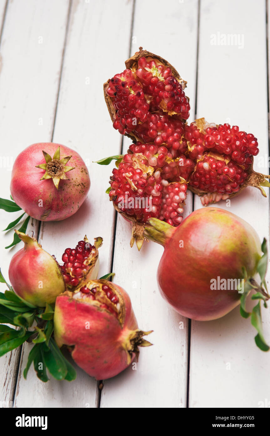 Pomegranate fruit on old white table Stock Photo