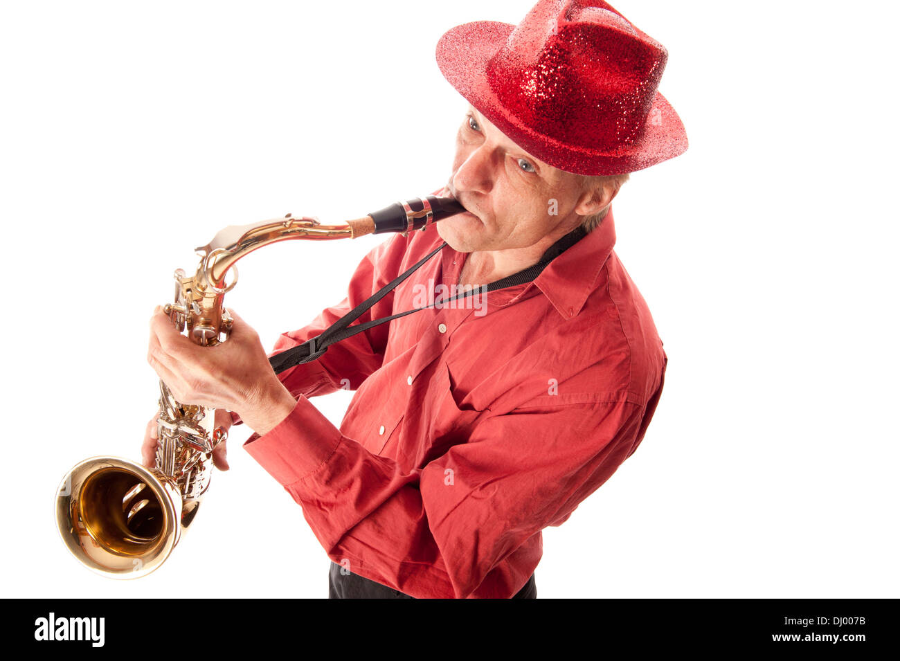 Male musician with hat playing a brass tenor saxophone from above Stock Photo
