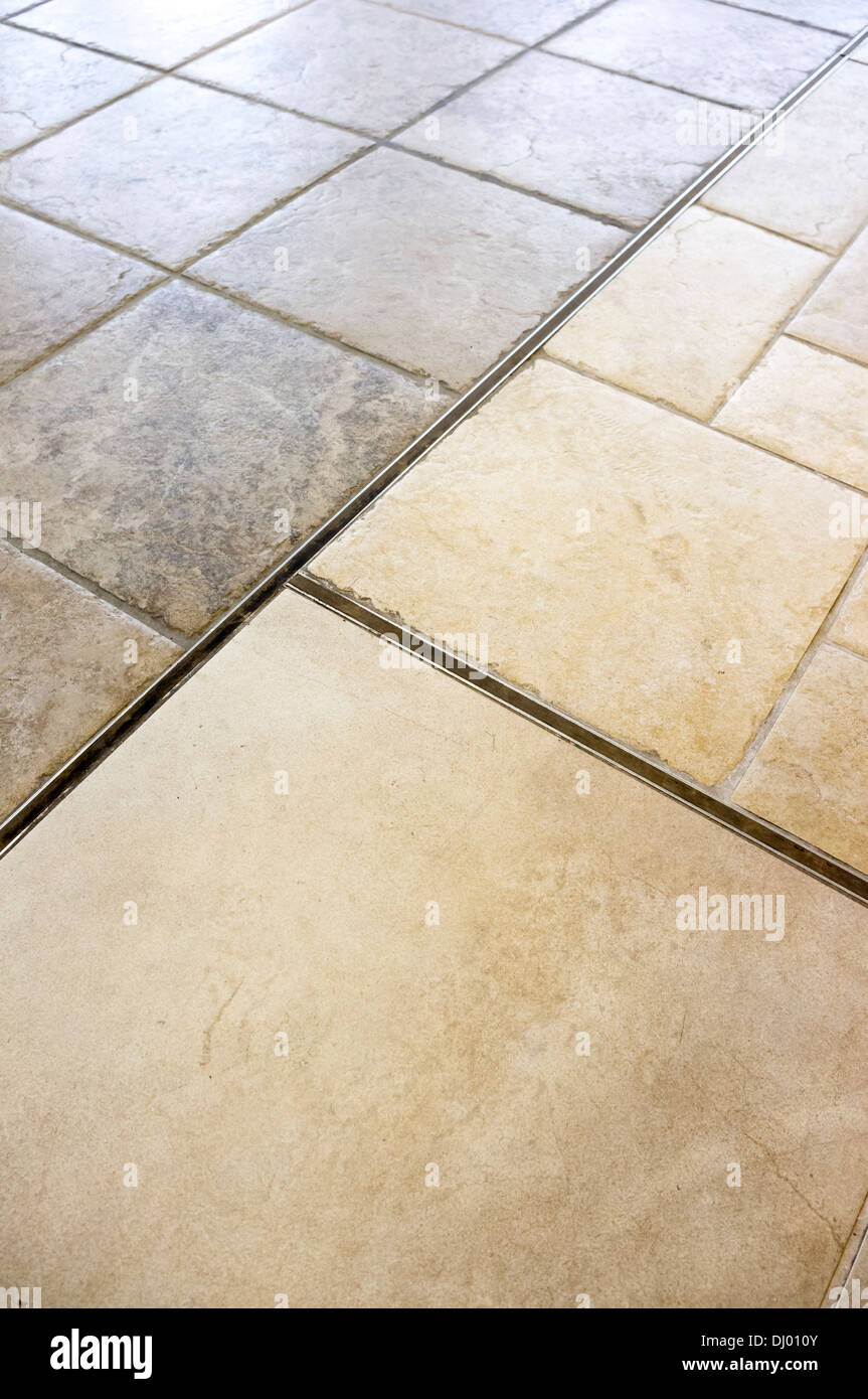 Rubber Expansion Joints Between Sections Of A Ceramic Tiled Floor Stock Photo Alamy