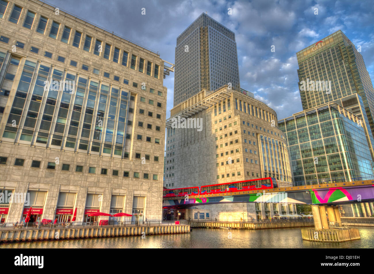 Canary Wharf with Dockland Light Railway train leaving the station Stock Photo