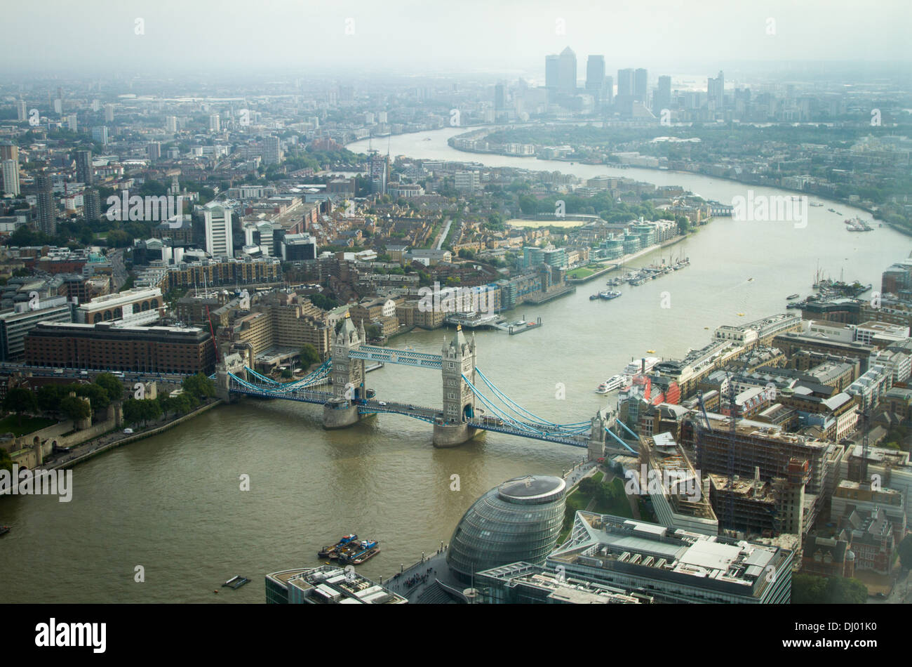 View of Tower Bridge on the Thames through London on to Canary Wharf. Taken  from the Shard. Stock Photo