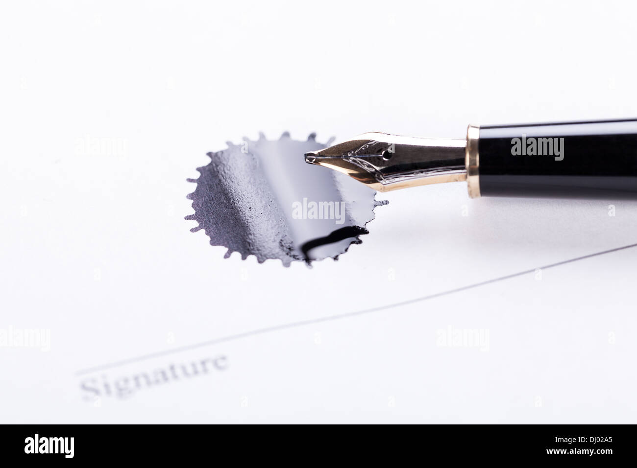 detail black fontain pen and ink blot on white paper object sign signature Stock Photo