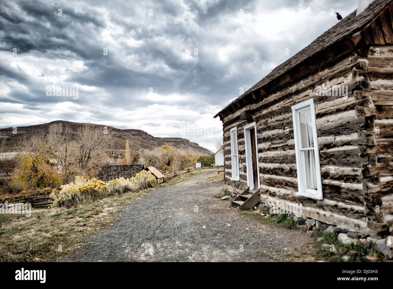 GOLDEN, Colorado - Log cabin at the Clear Creek History Park in Golden, Colorado, showing the historic frontier life of the region's early settlers. Founded during the Pike's Peak Gold Rush, Golden today is known for its rich heritage, outdoor activities, and being the birthplace of Coors Brewery, embodying a unique blend of history, culture, and natural beauty. Stock Photo