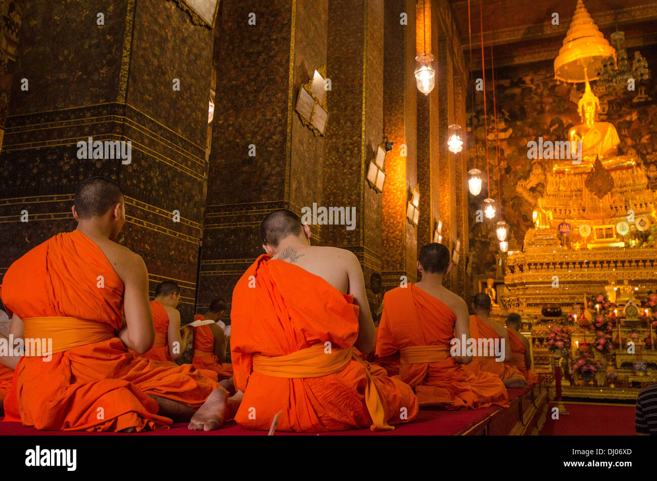 Buddhist monks, chanting and praying in Bangkok, Thailand Stock Photo