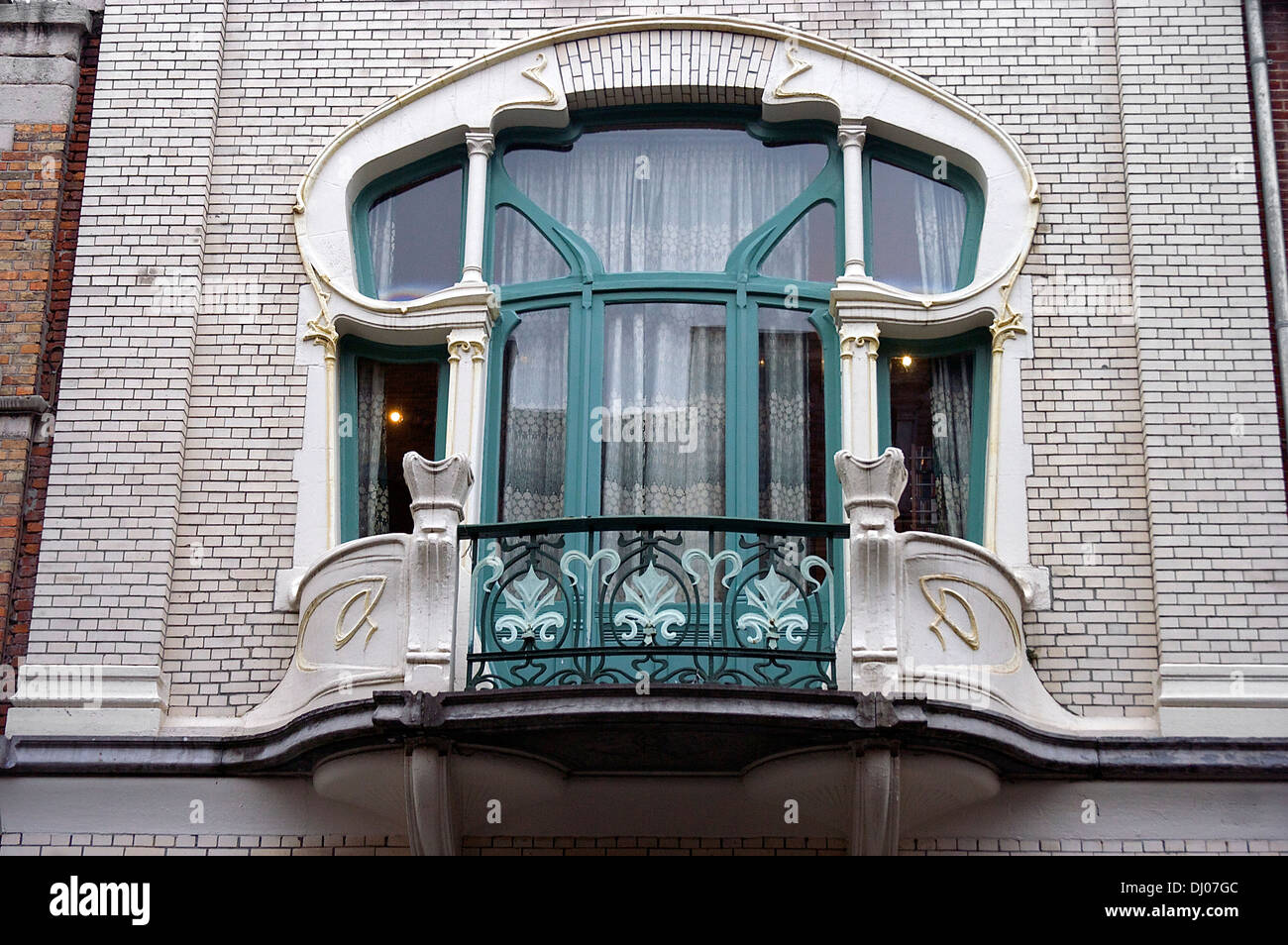 Europe, Belgium, Antwerp. An ornate window in a home in Antwerp's historic Zurenborg neighborhood Stock Photo