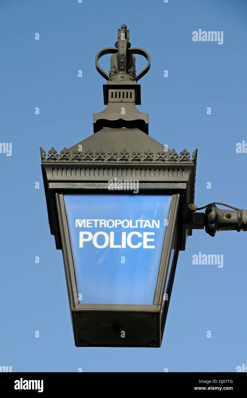 Traditional blue lamp, light or lantern with Metropolitan Police on front outside Holborn Police Station, London England UK Stock Photo