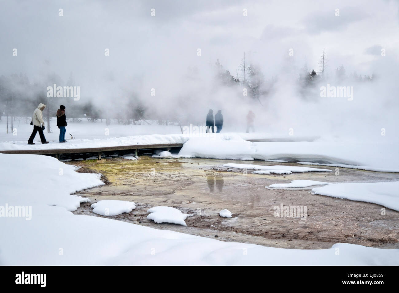 Tourists at Fountain Paint Pot in winter, Yellowstone National Park, UNESCO World Heritage Site, Wyoming, USA, North America Stock Photo
