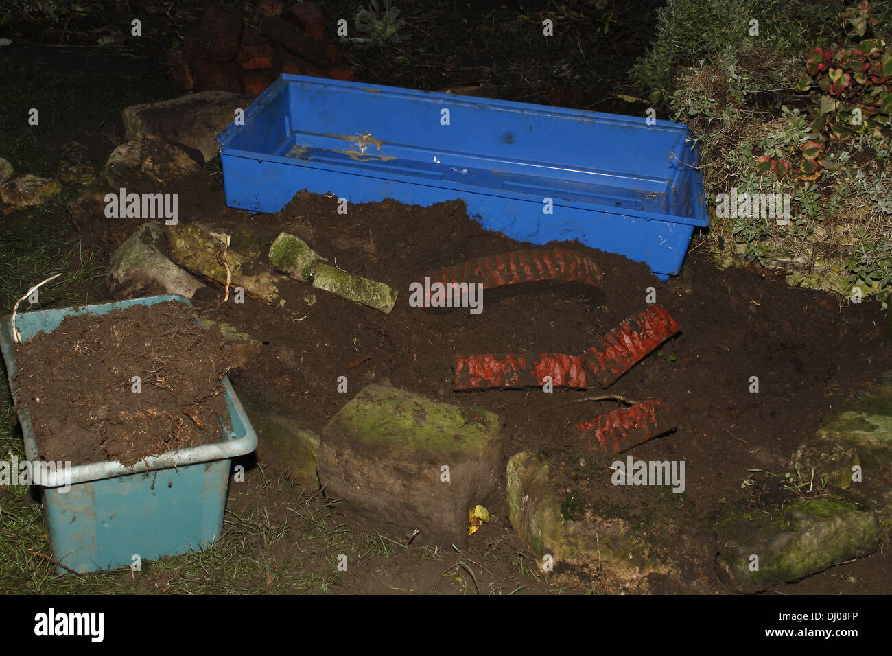 making a small garden pond in a rockery Stock Photo