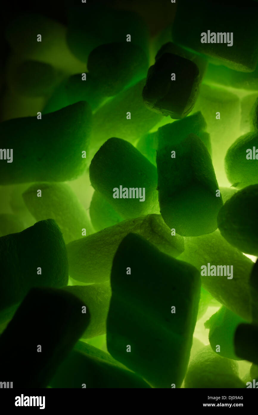 styrofoam packing peanuts glowing green Stock Photo Alamy