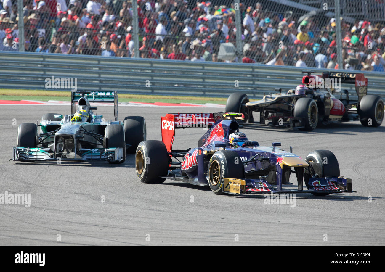 Drivers steer their Formula 1 cars through turn one during the U.S. Grand Prix at the Circuit of the Americas near Austin TX Stock Photo