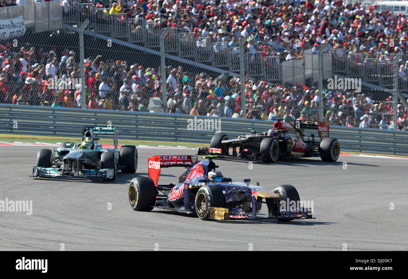 Drivers steer their Formula 1 cars through turn one during the U.S. Grand Prix at the Circuit of the Americas near Austin TX Stock Photo