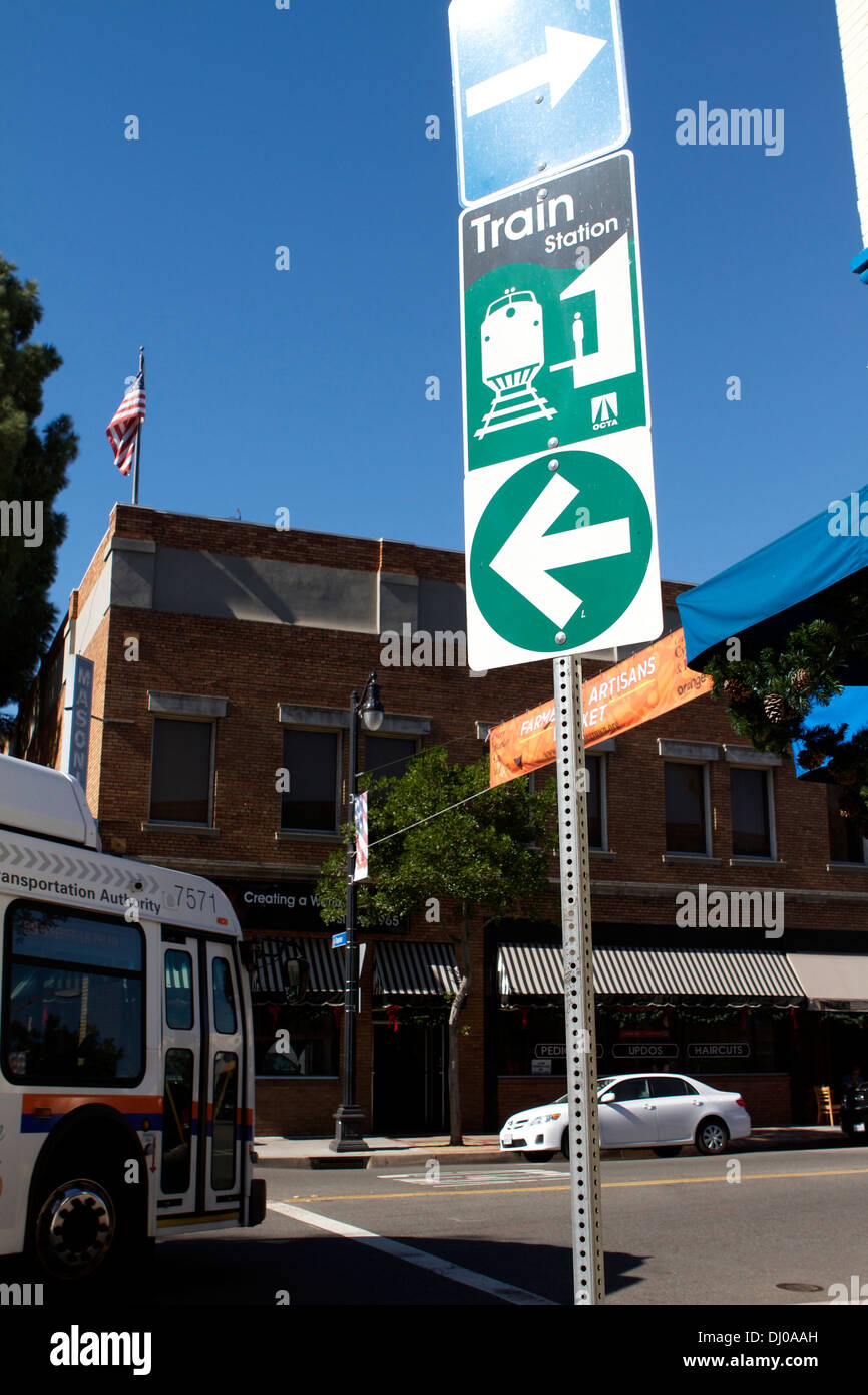 A road sign in Old Towne Orange California giving direction to the railway station Stock Photo