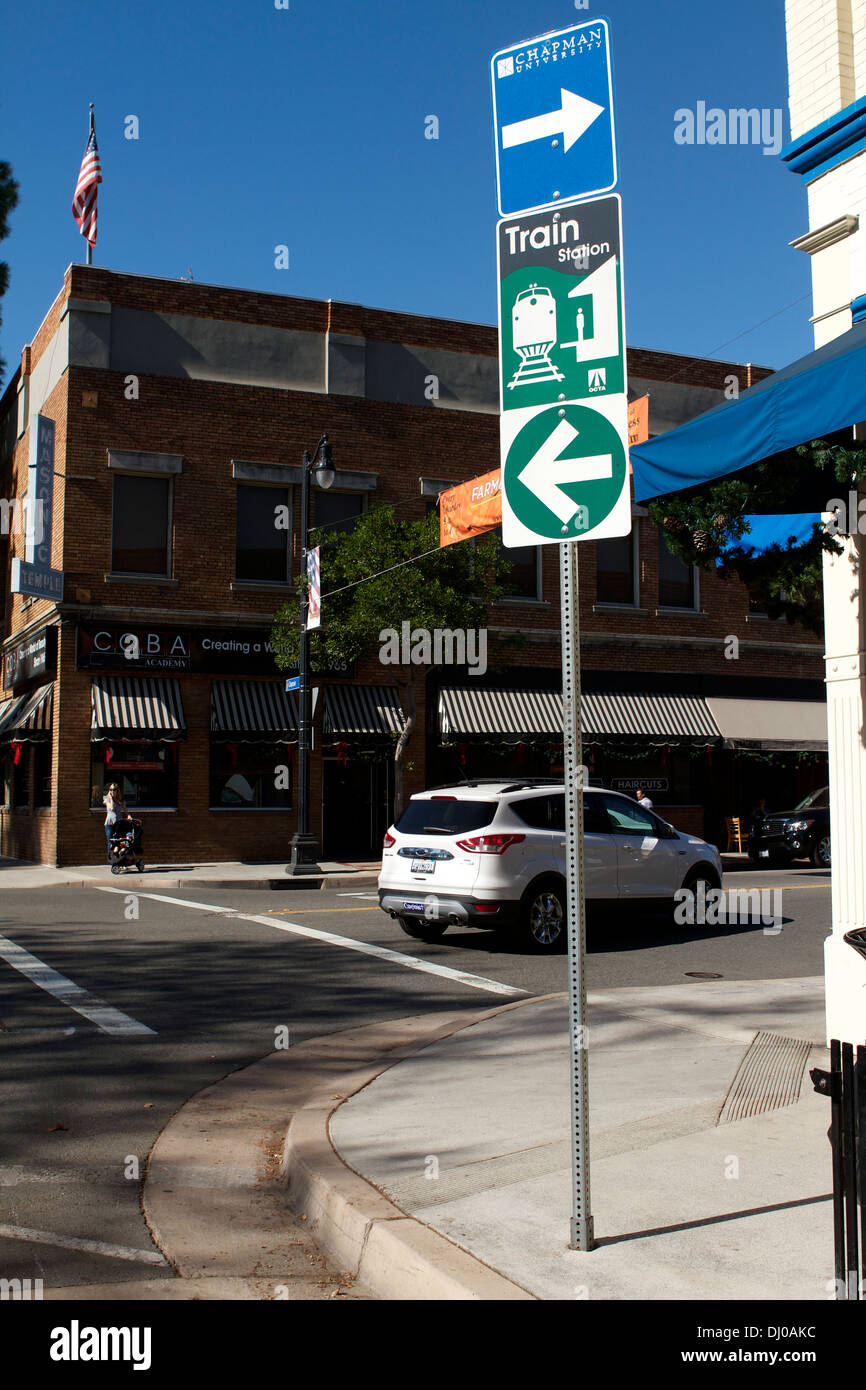 A road sign in Old Towne Orange California giving direction to the railway station and Chapman university Stock Photo