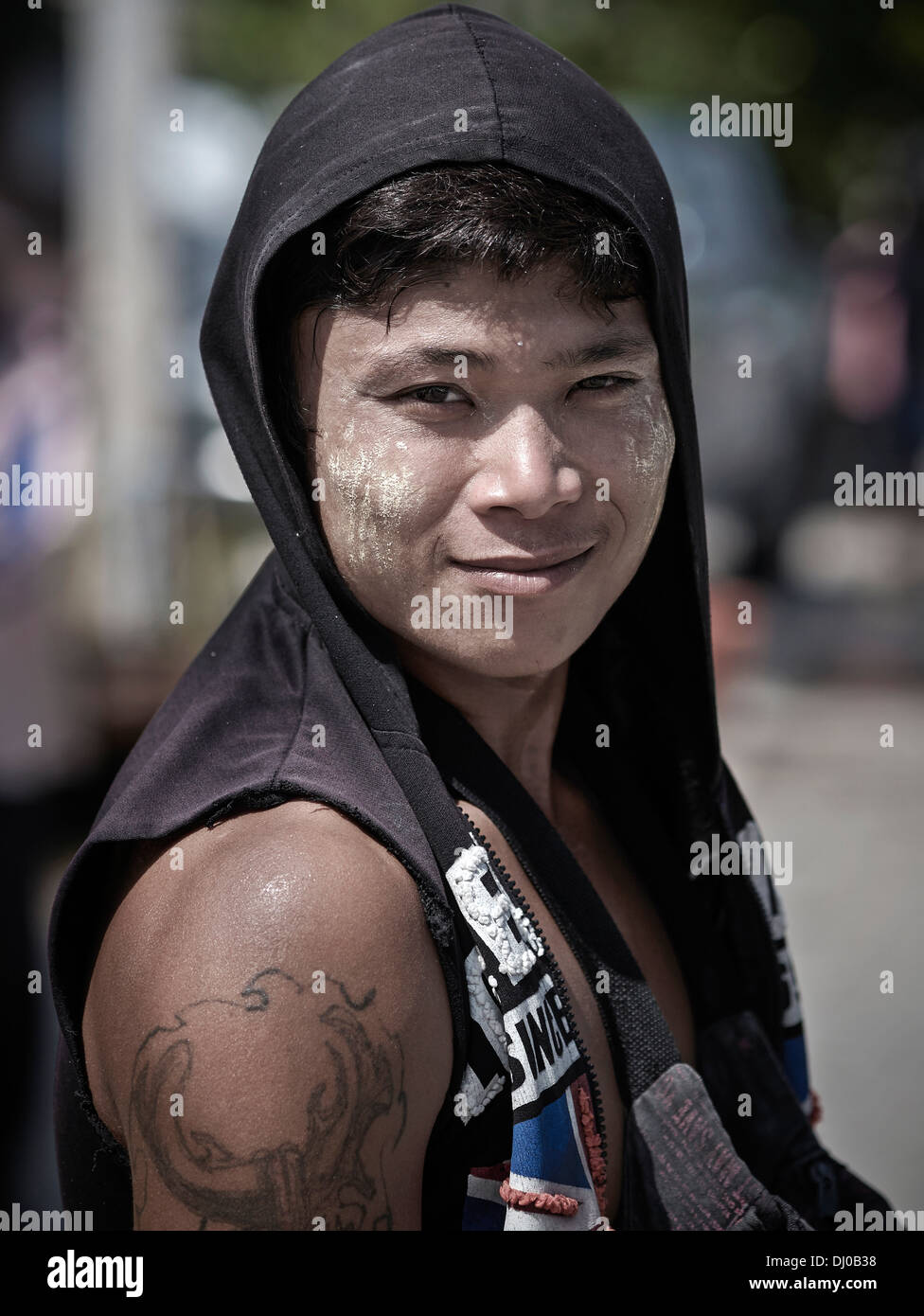 Portrait of a Thai male wearing a hoodie and sporting an arm tattoo. Thailand S. E. Asia Stock Photo