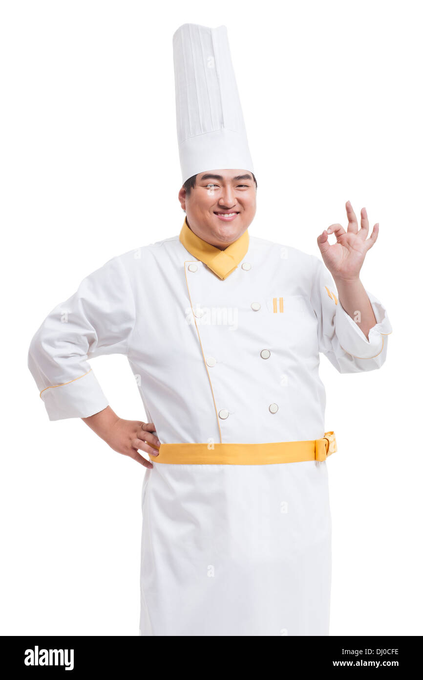 Confident Chubby cook doing OK sign Stock Photo