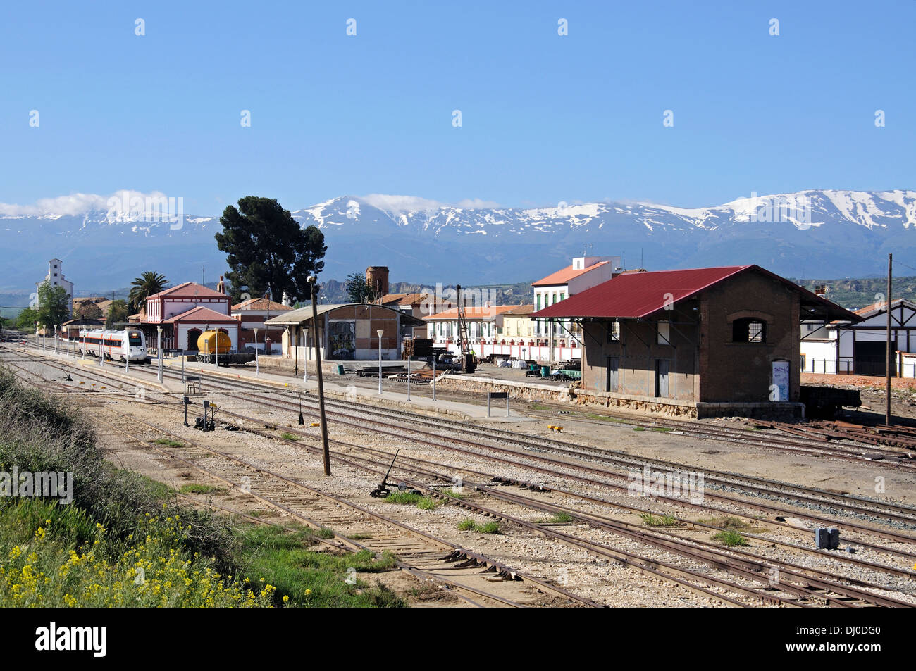 Renfe S-598 medium distance train leaving the station, Guadix, Granada Province, Andalusia, Spain. Stock Photo
