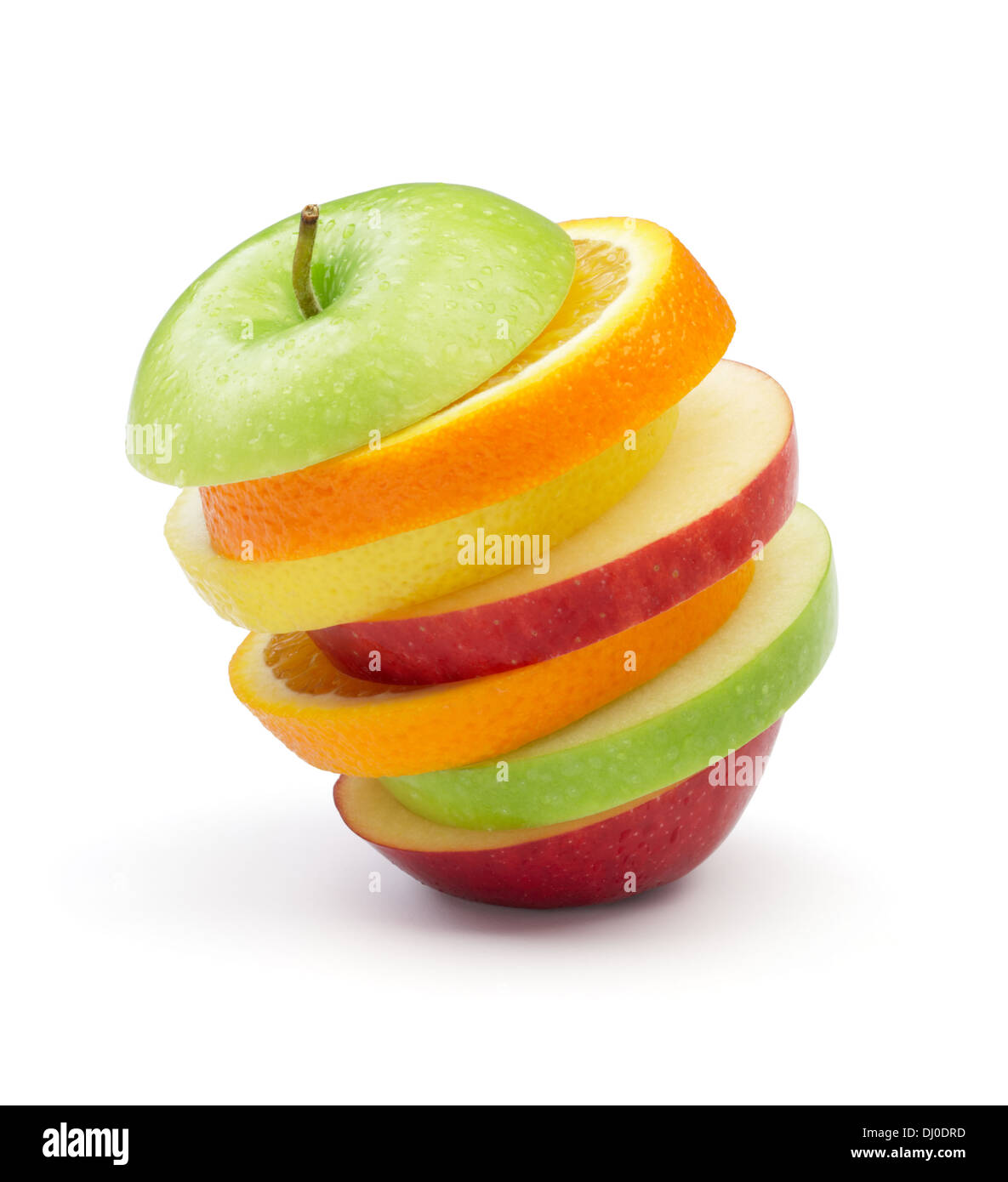 various type of fruits in slices stacked on white background Stock Photo