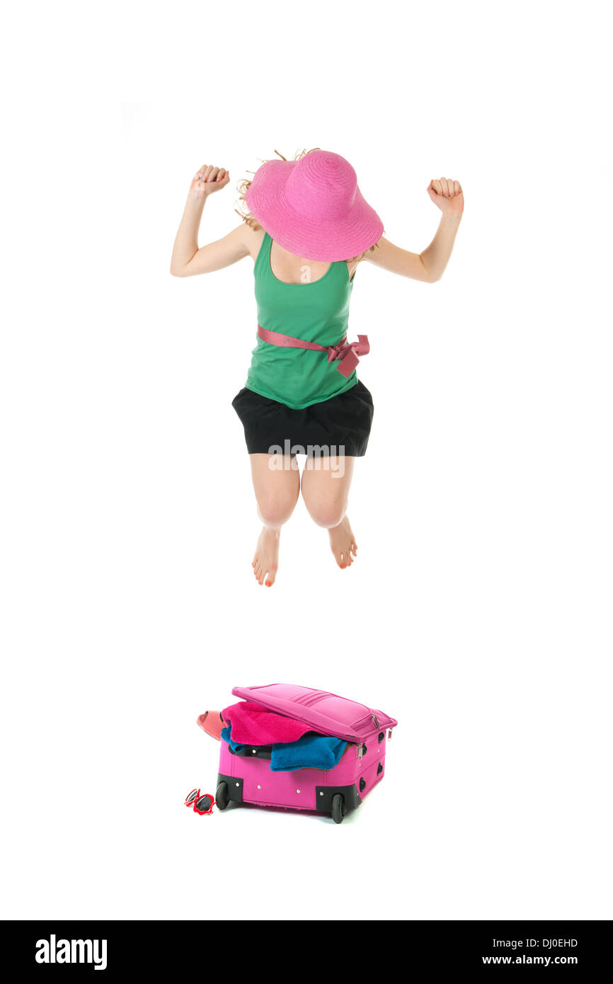 Jumping on the suitcase for closing isolated over white background Stock Photo Alamy