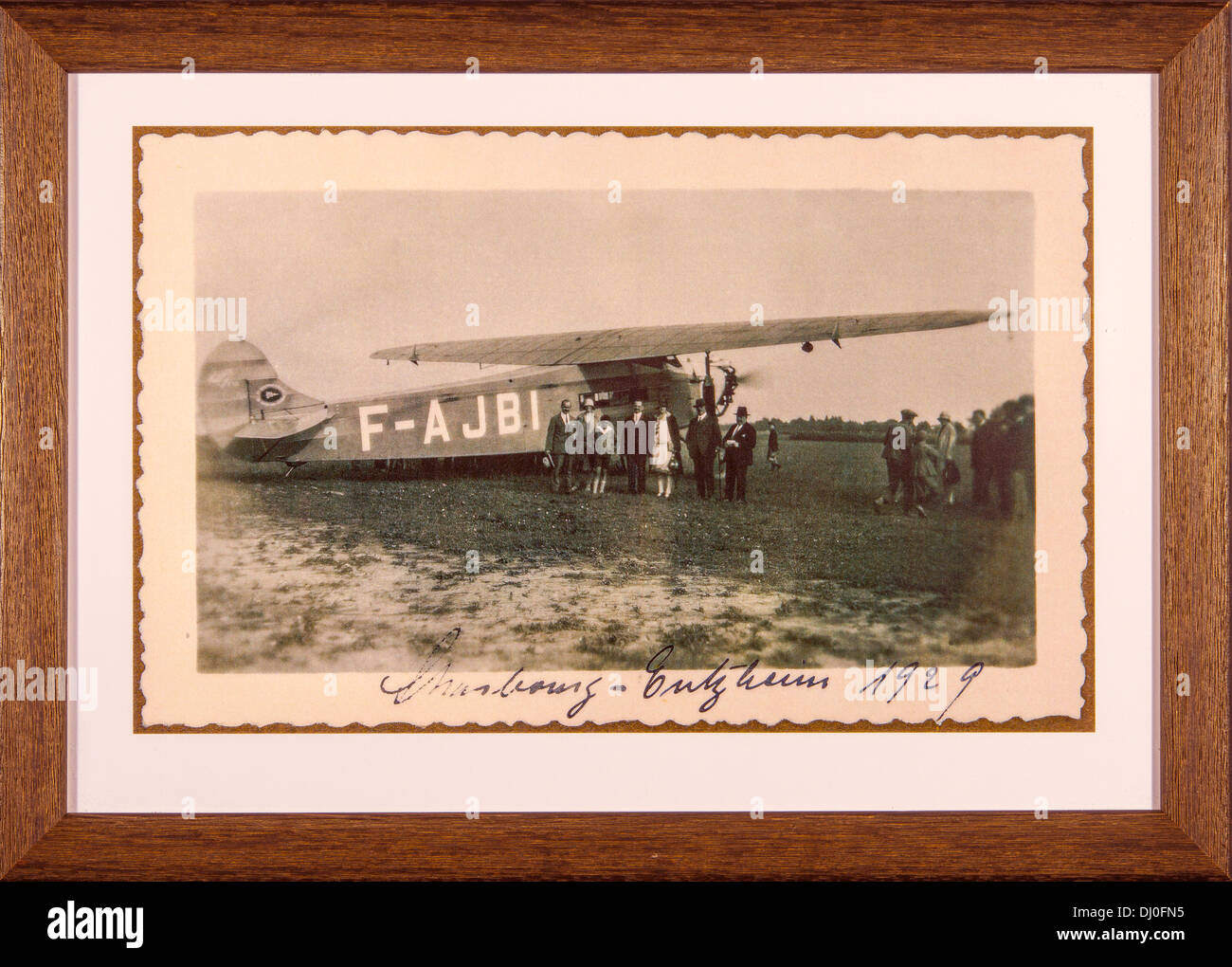 Framed 1929 vintage picture of Strasbourg-Entzheim airport with retro Fokker airplane and passengers Alsace France Europe Stock Photo