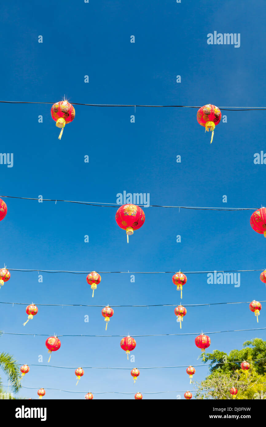 Red chinese new year lanterns against blue sky Stock Photo