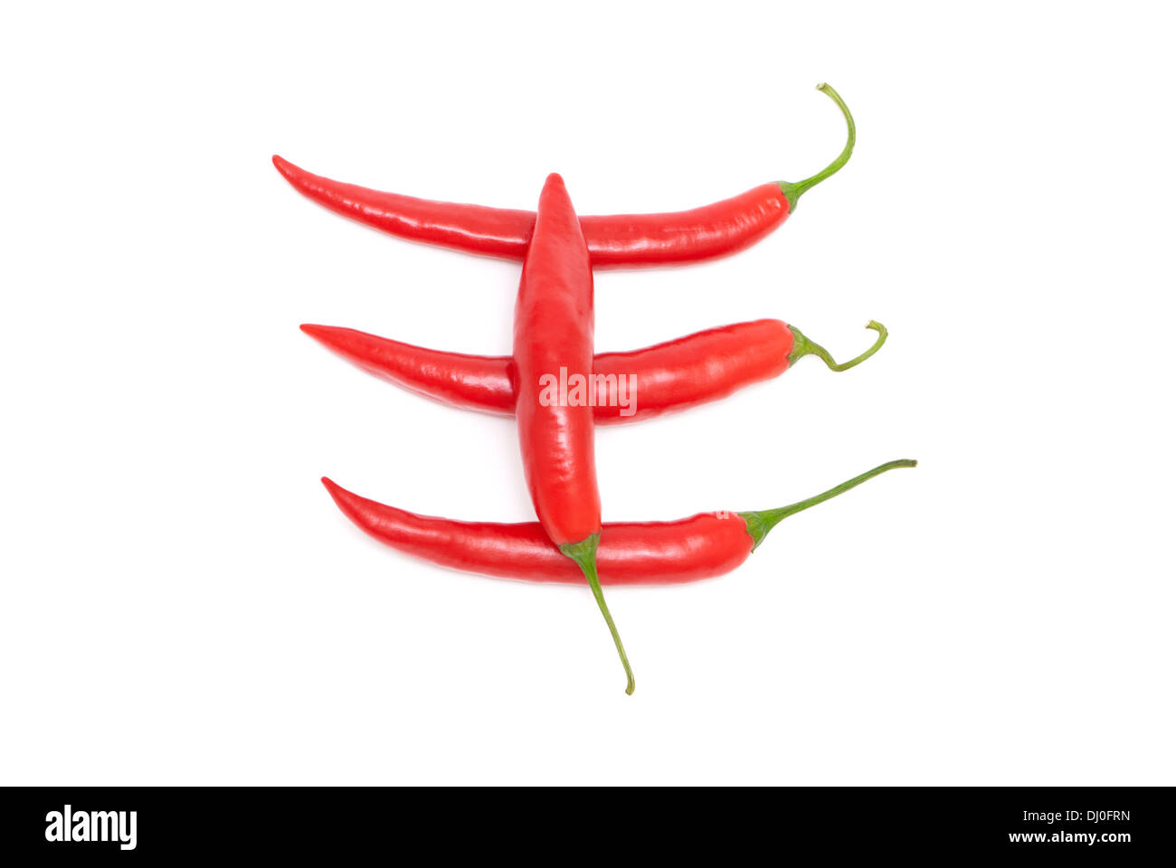Four red hot chili peppers on a white background Stock Photo - Alamy