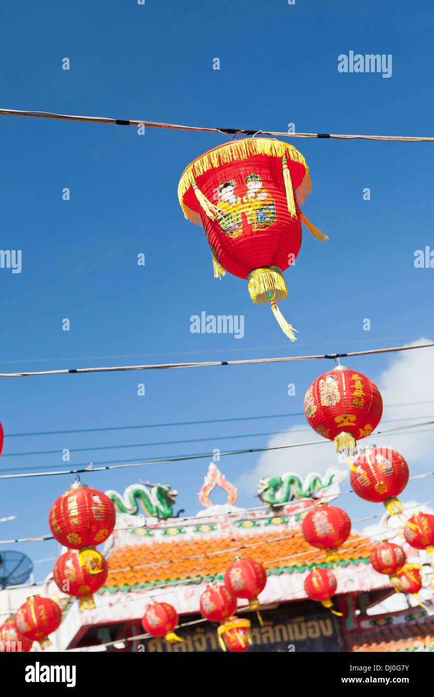 Red chinese new year lanterns against blue sky Stock Photo