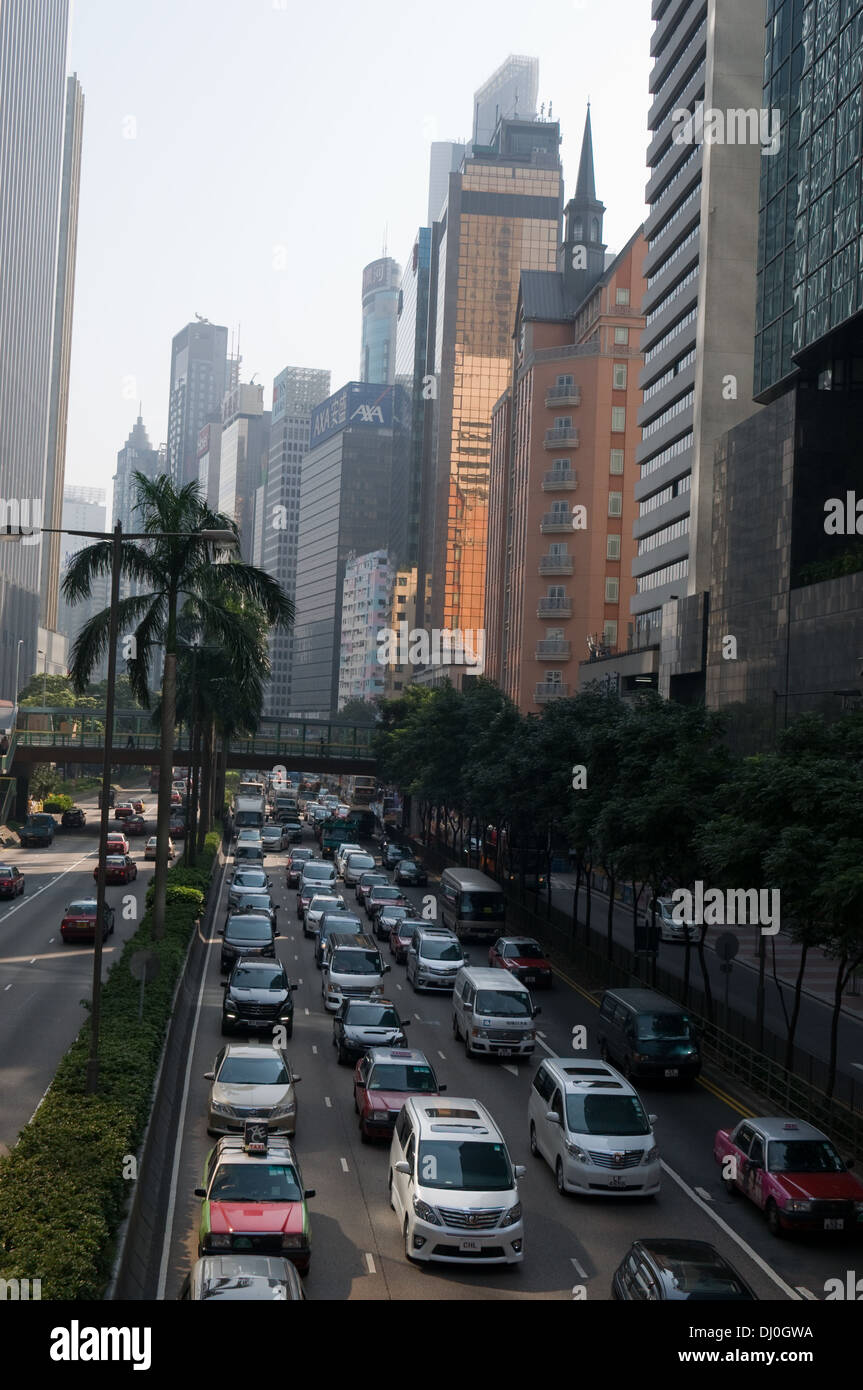 Traffic queues back in rush hour on Hong Kong island. The tall buildings of the Wan Chai district are in the background Stock Photo