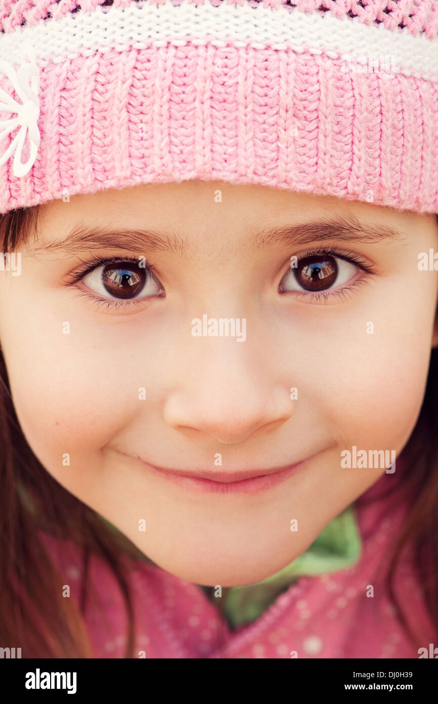 Girl with big brown eyes closeup looking into the camera Stock Photo
