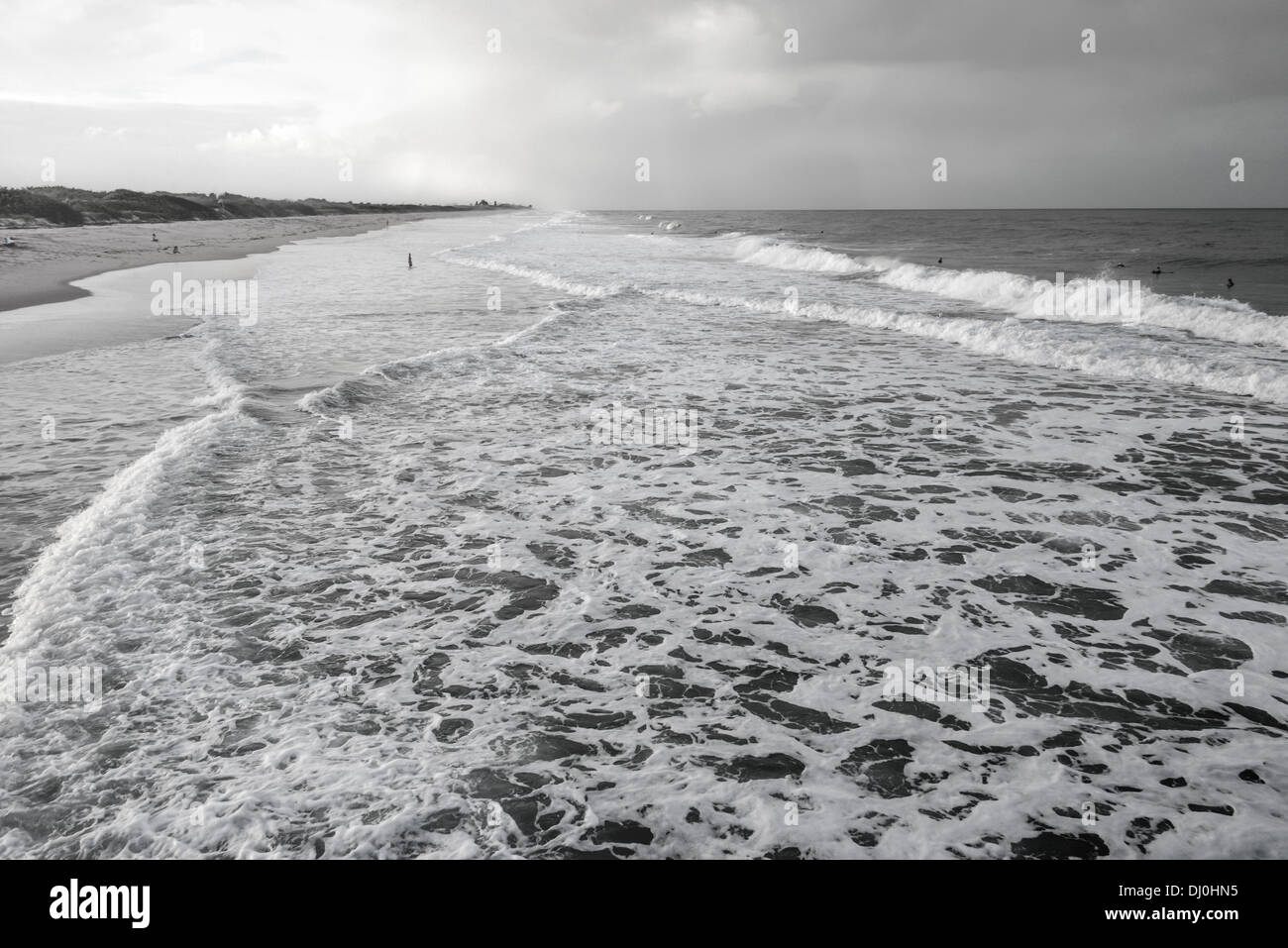 Black and white beach scene with a lot of  surf foam in Florida. Stock Photo