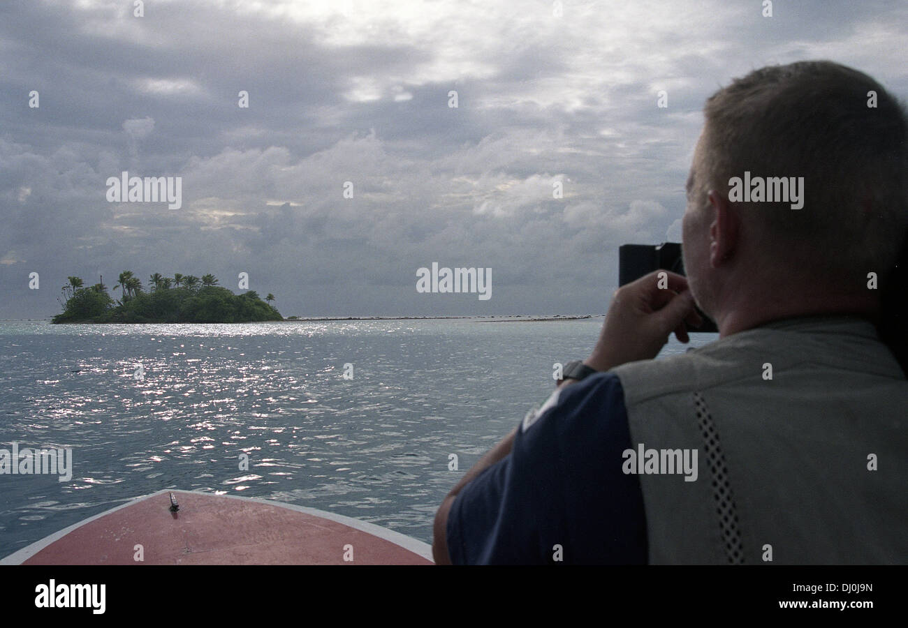 Kon Tiki Island. A photographer filming the Raroia Island. Tahiti. French Polynesia. Stock Photo