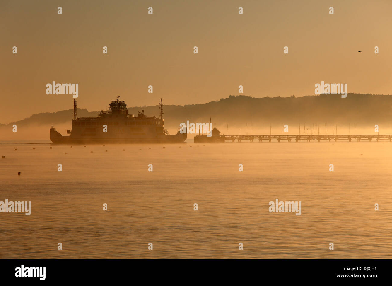 Early morning Wightlink ferry approaching Yarmouth Isle of Wight Hampshire England Stock Photo