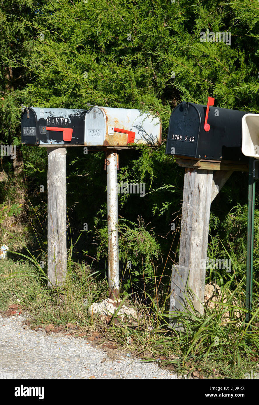 3 US Mail boxes on a rural road in America Stock Photo
