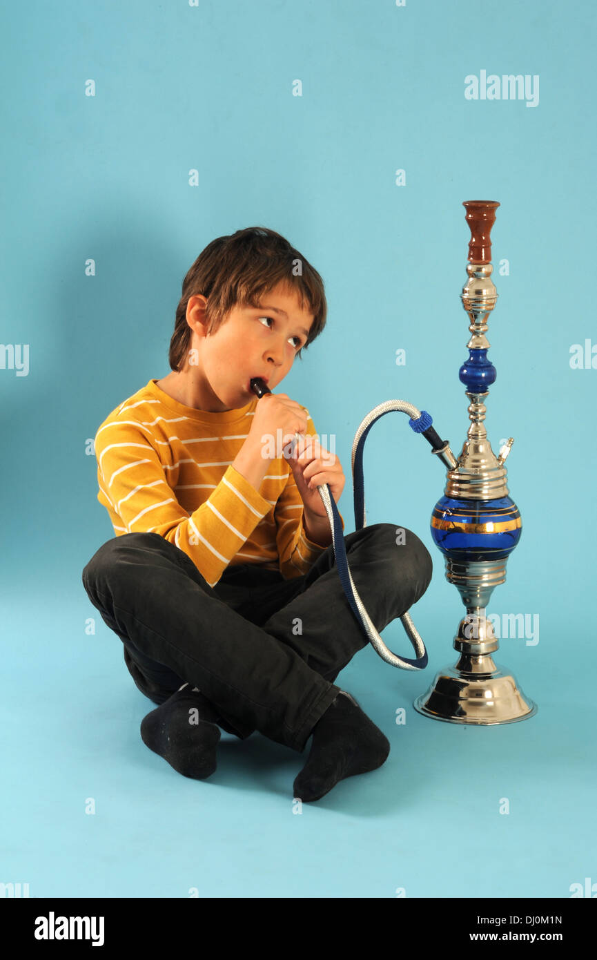Boy smoking a water pipe Stock Photo Alamy
