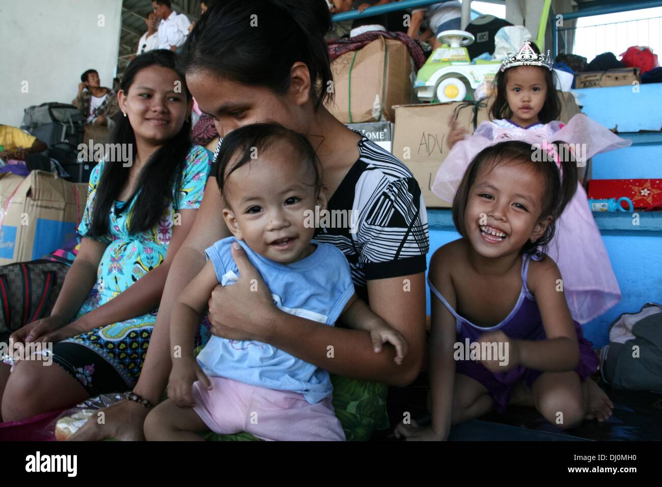 Manila, Philippines. 18th Nov, 2013. James Nathan celebrated his first birthday at the Villamor Airbase in Pasay City, South of Manila while waiting for a flight to Cebu. -- Thousands of displaced individuals from Tacloban and Ormoc City were flown to Villamor Airbase in Pasay City, South of Manila for shelter. Volunteers help feed and counsel the evacuees who suffered emotional trauma after surviving one of the biggest storms to hit land, Haiyan.Photo: J Gerard Seguia/NurPhoto Credit:  J Gerard Seguia/NurPhoto/ZUMAPRESS.com/Alamy Live News Stock Photo
