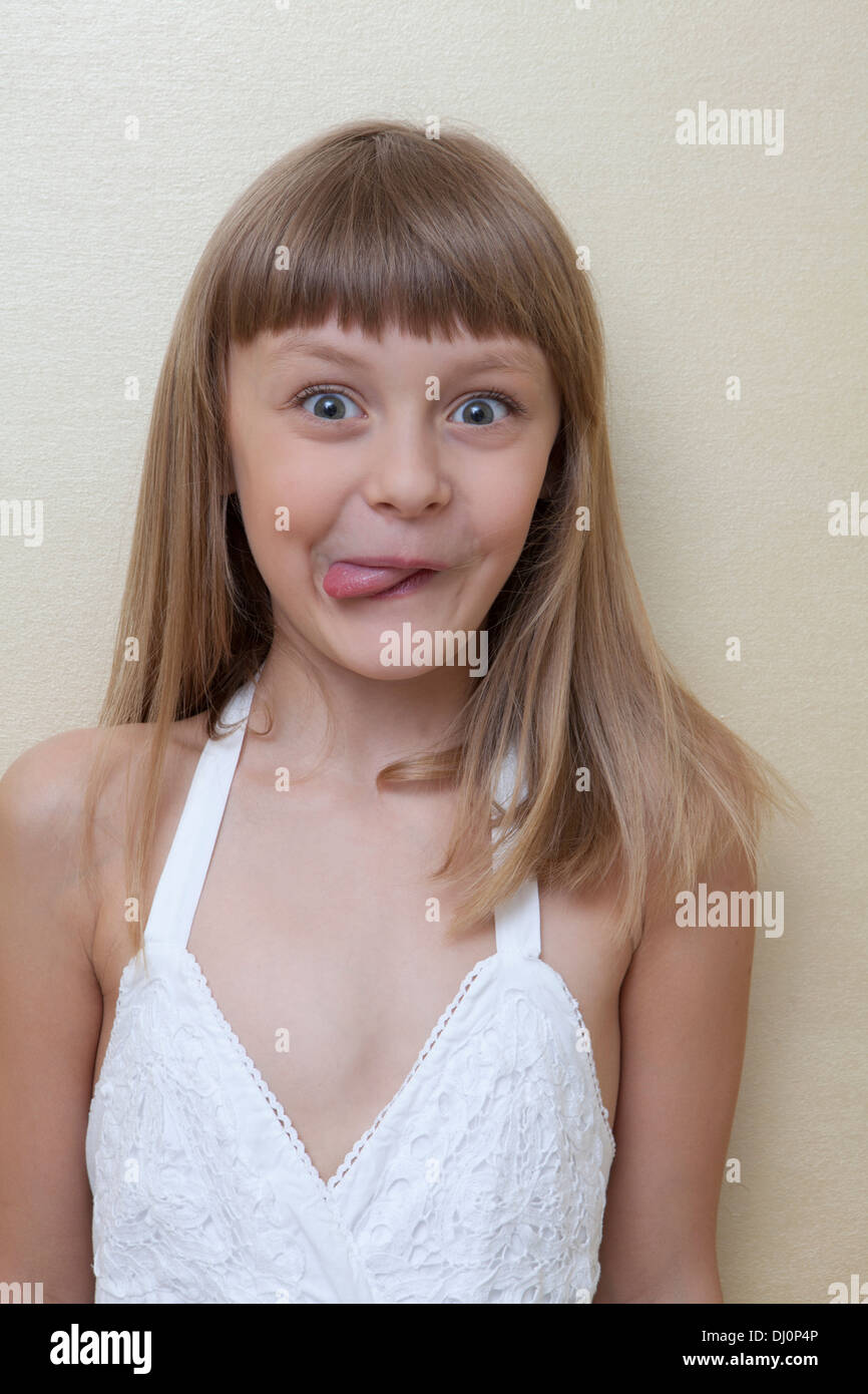 Little girl make a grimace Stock Photo