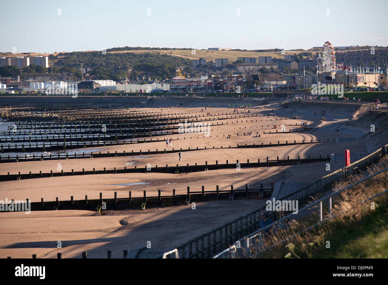 City of Aberdeen, Scotland. Aberdeen esplanade and beach with Codona's Amusement Park in the background. Stock Photo