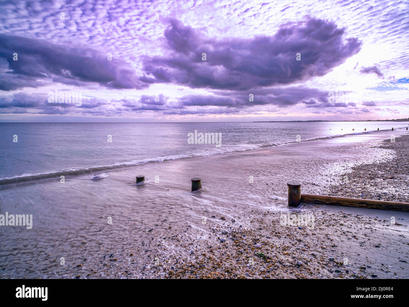 Small Groyns post in Aldwick Beach, West Sussex, UK Stock Photo