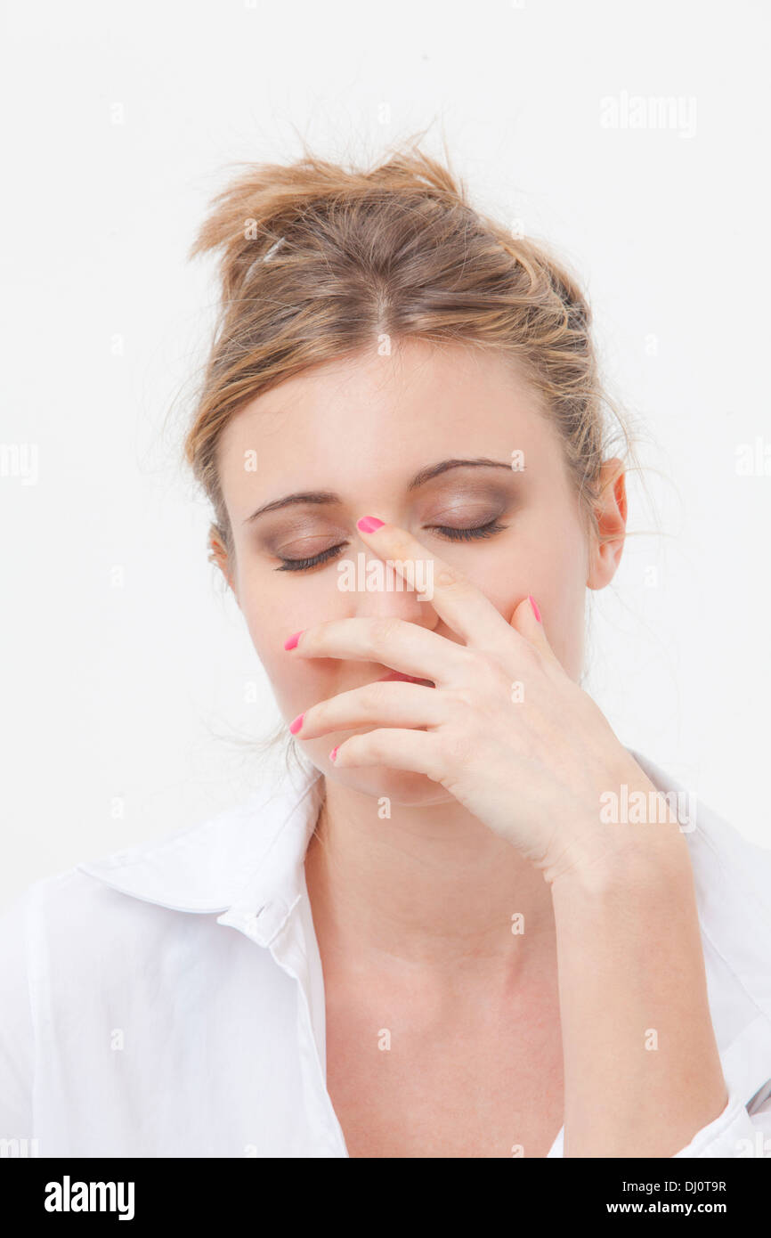 woman with hand on face Stock Photo