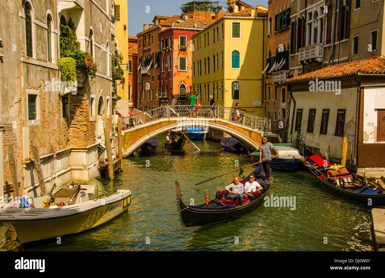 Enjoying a gondola ride in Venice, Italy. Stock Photo