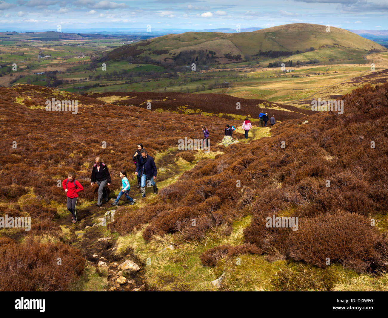 People walking in upland countryside at Gowbarrow Park near Ullswater in Lake District National Park Cumbria England UK Stock Photo