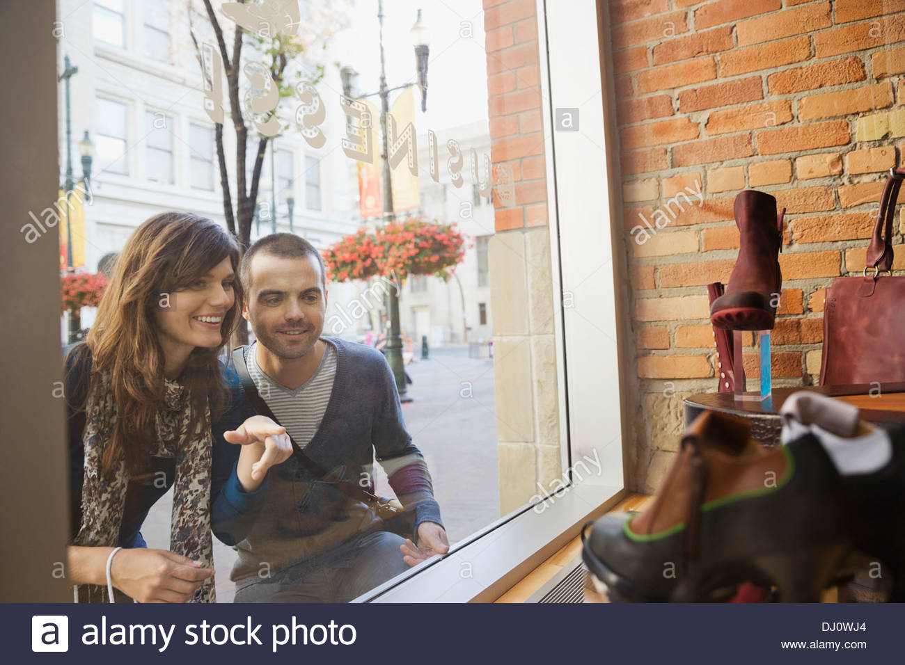 Smiling couple window shopping Stock Photo