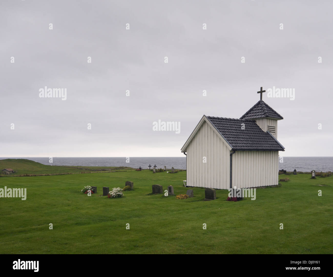 Small chapel and old cemetery on the edge of the North sea, Jæren Norway near Stavanger in gloomy weather Stock Photo