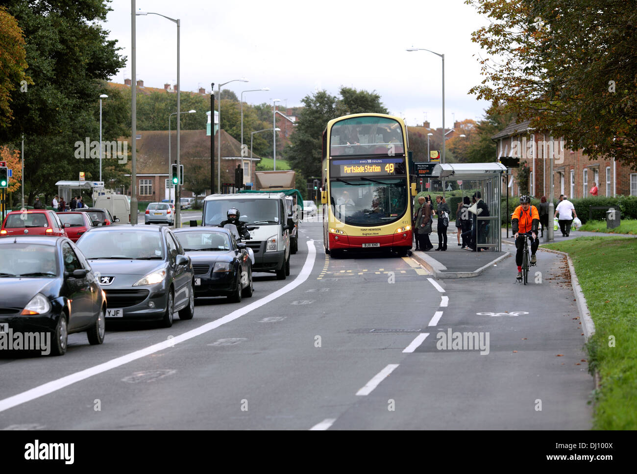 Bus lane and separate cycle lane,  Lewes Road, Brighton. The bus stop is positioned between the bus lane and cycle lane. Stock Photo