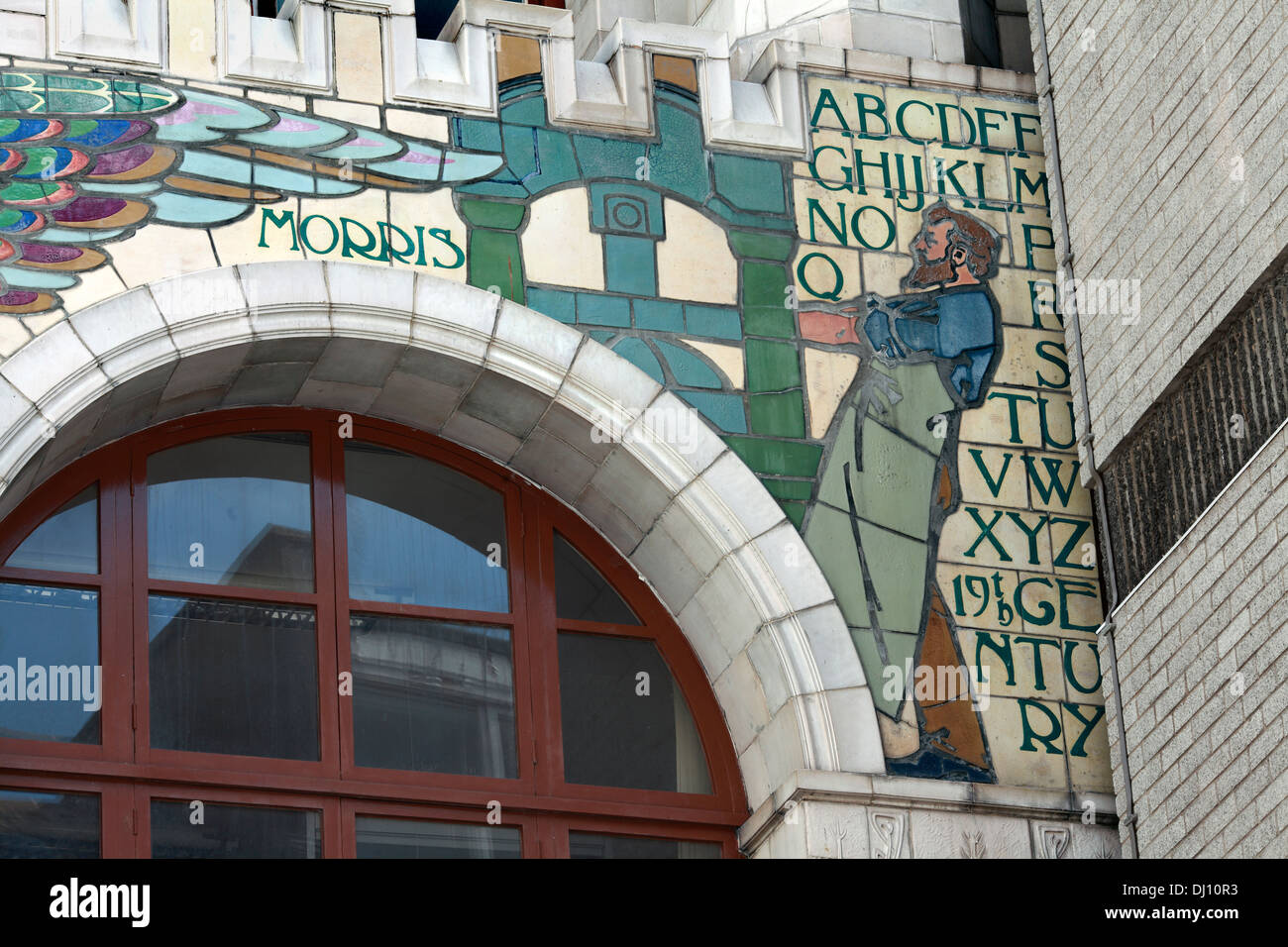 A mural depicting William Morris at a printing press, on the facade of the former Edward Everard's print works, Bristol. Stock Photo