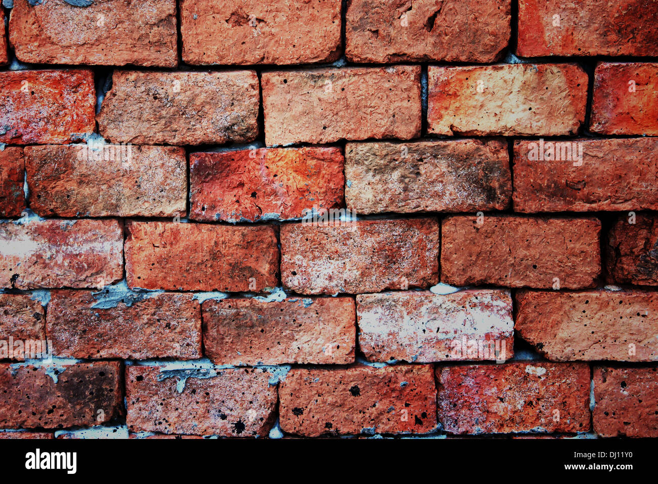 The Brick Background vivid color arising from various types of stone. Stock Photo